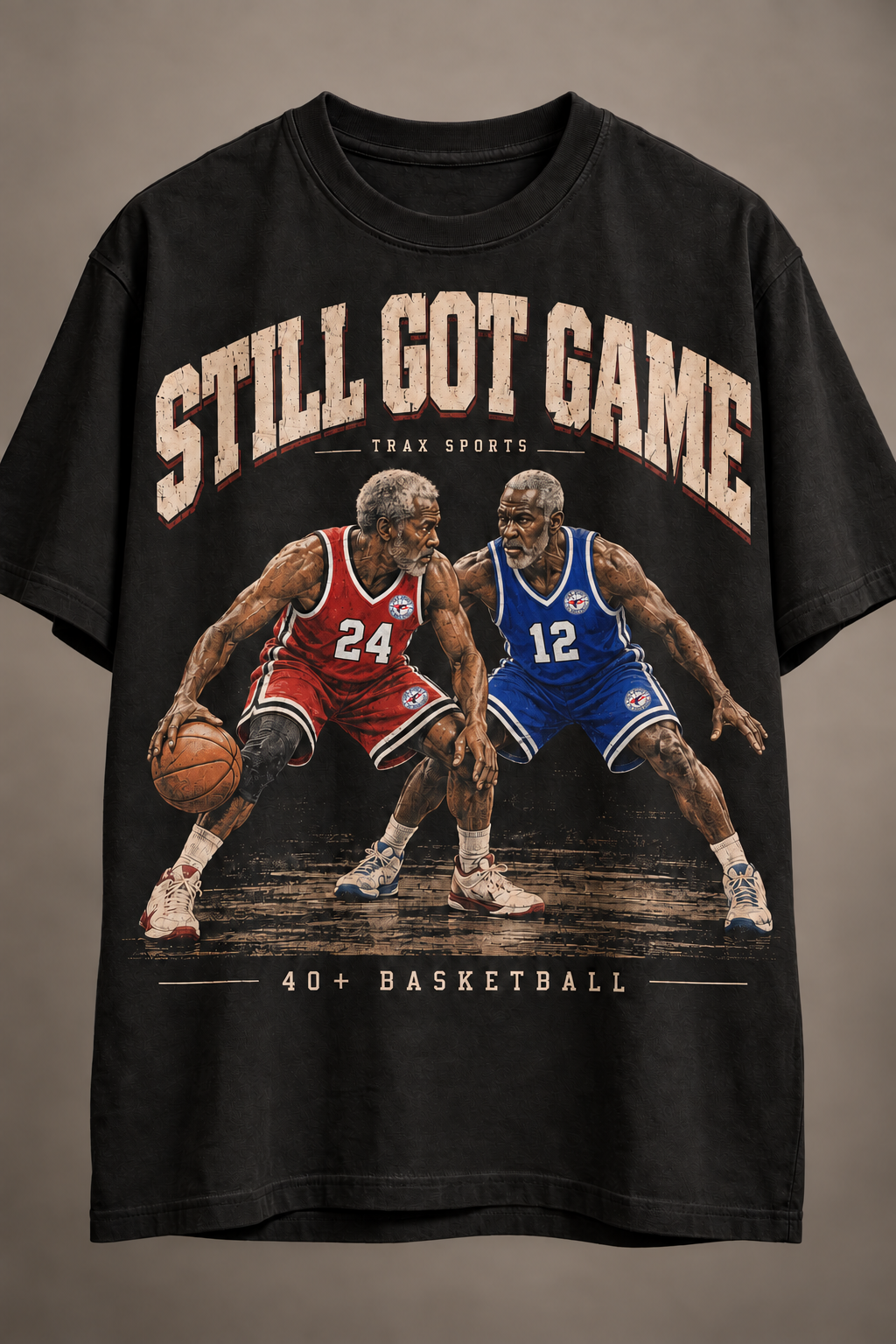 Black Trax Sports Still Got Game tee concept with two gray-haired Black men playing one-on-one basketball